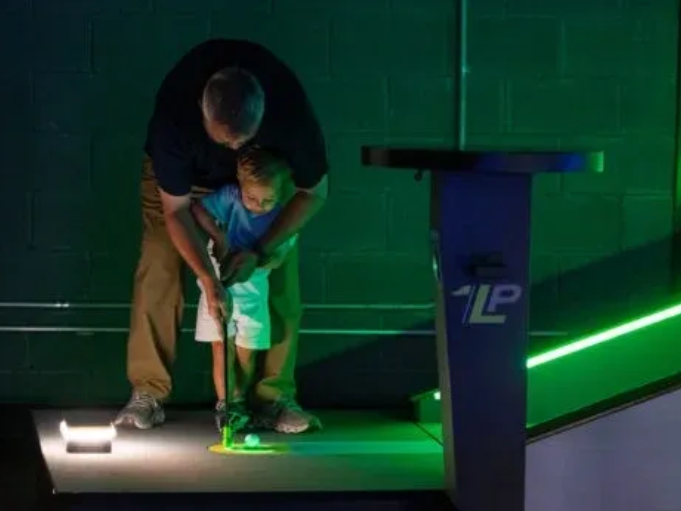 Guest playing indoor putt putt at Putter Up
