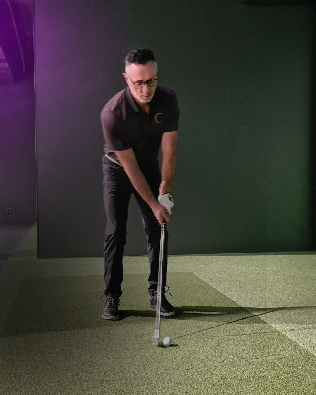 Guest playing golf on the Putter Up simulator